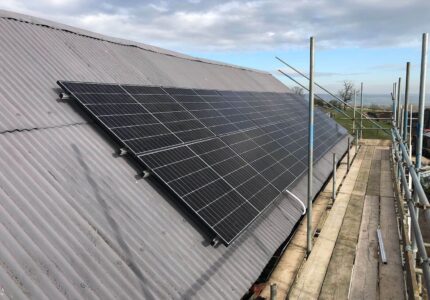 Solar Panel Installation on a Farm Building Roof